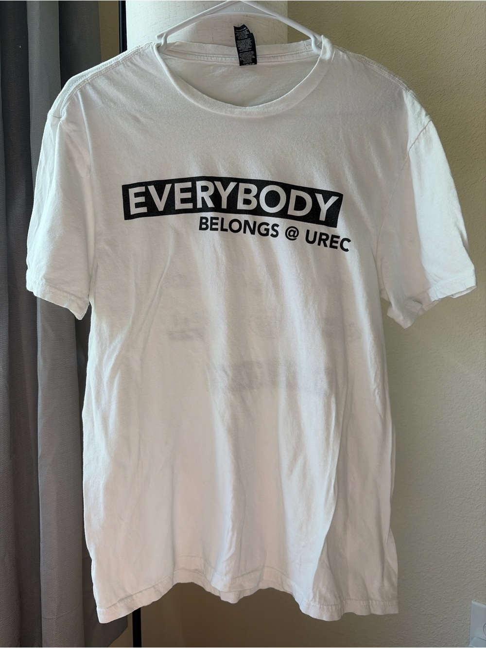 District White T-Shirt with Black "EVERYBODY BELONGS @ UREC" Graphic